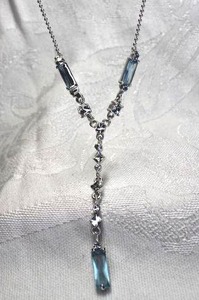 lot 439 image: Elegant faceted Swiss Blue glass and rhinestone lariat style necklace on micro bead style silver finish polished chain. Tests as glass. 16L Lobster clasp