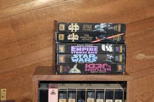 lot 186 image: Large Media Lot Including VHS Tapes, VHS Cabinet, TV, and More