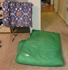 lot 139 image: Sleeping Bag, Comforter, and Gold Toned Quilt Rack