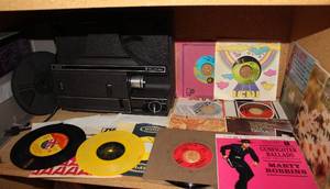 lot 179 image: Vintage 45 RPM Records From a Jukebox and a Vintage Film Projector