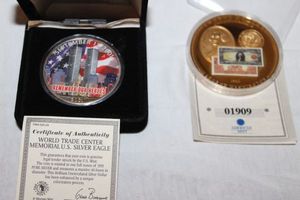 lot 14 image: World Trade Center Memorial ,999 US Silver Eagle 1oz. Coin, and Commemorative twenty dollar Gold Certificate George Washington coin