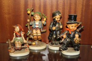 lot 27 image: Hummels Just Resting, Apple Tree Boy, Chimney Sweep, and Chimney Sweeper Boy