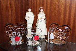 lot 32 image: Vintage Bride and Groom Cake Toppers and Barron Blown Glass Love Giftables
