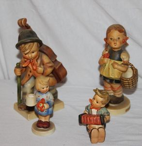 lot 38 image: Hummels Boy with Accordion, Adbent Candle Stick Girl with Nosegay, Sister, Little Cellist