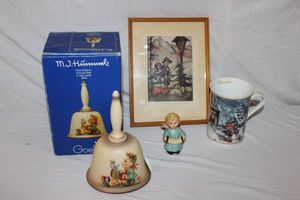 lot 39 image: Hummels First Edition Annual Bell, Angel with Accordion, Framed Hummel Photo and Novemer Hummel mug