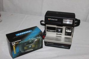 lot 52 image: Vintage Poloroid Sun 600 and Unused 35MM Camera