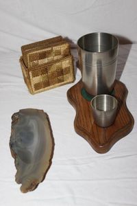 lot 56 image: Stainless Steel Mixer Cups, Coasters, and Polished Stone Ashtray