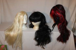 lot 75 image: Three Long Length Stylish Wigs, Synthetic
