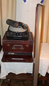 lot 96 image: Vintage Kodak Projector in Case with extra Lenses and Projector Screen