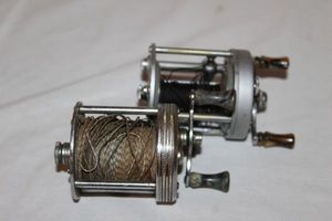 lot 165 image: JC Higgins 400 and Pflueger Supreme Fishing Reels
