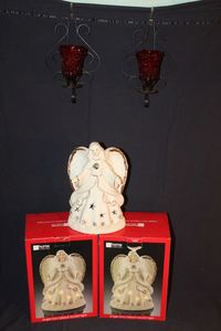 lot 430 image: Two Decorative AngelCandle Holders