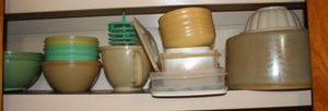 lot 132 image: Vintage Tupperware and Egg storage container most without lids, Cake Saver with Lid, and Egg Dish with Lid
