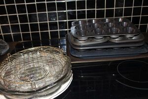 lot 147 image: Muffin pans and cooling racks, Cake plates and more