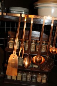 lot 218 image: Copper Hanging Cooking Utensils with Hanger, Spice Rack with Copper Lidded Spice Jars