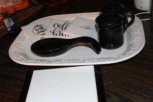 lot 221 image: Turkey Platter, Black Salt and Pepper Shakers, Spoon rest and Coasters