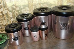 lot 228 image: Vintage Canisters with Matching Salt and Pepper Shakers