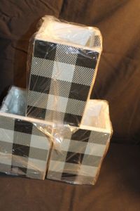 lot 302 image: Black and white checked planter boxes