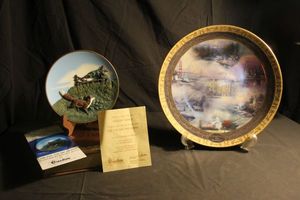 lot 403 image: Two Decroative Plates, Thomas Kinkade America the Beautiful and The Fox and the Grapes