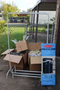 lot 567 image: Two Clothing Racks and Large amount of Hangers