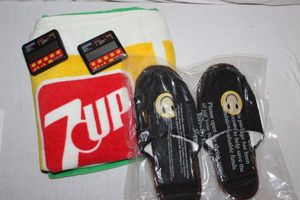 lot 630 image: 7up Towel, Smilie Slippers and Pocket Games