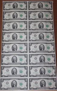 lot 390 image: Uncut, Uncirculated, Sheet of Sixteen Two Dollar Bills