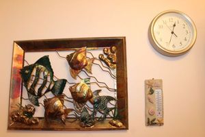 lot 47 image: Metal and Copper Fish Wall Dcor, Thermometer and wall Clock