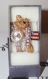lot 65 image: Womens Watch and Bracelet with Two Pendants