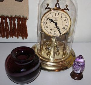 lot 68 image: Vintage Elgin Anniversary clock, Purple Hand Blown Egg Paperweight and Purple and White Swirl Glass Vase