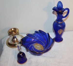 lot 72 image: Vintage Cobalt Glass Decanter Bottle, Blue and Gold, Cobalt Blue Depression Glass Bowl with Gold Accent, Silverplate Candle Holder and Bohemian Cobalt Blue with Gold Trim Bell