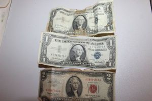 lot 23 image: 1963 Red Seal $2 Dollar Silver Certificate, 1957 $1 dollar Silver Certificate, and 157A $1 Dollar Silver Certificate