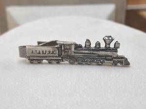 lot 35 image: Vintage train tie clip