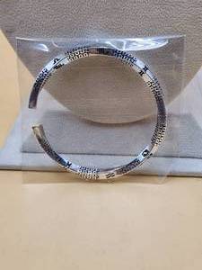 lot 31 image: Silver bracelet marked .999 - jewelry