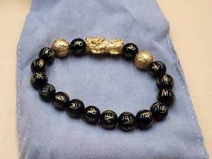 lot 66 image: Buddha Powers bracelet in box - jewelry