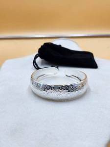 lot 149 image: Silver Bracelet marked .999 - jewelry
