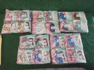lot 59 image: Selection of Nurse essential items - Designer- Stretchy Wide Design Headband with Buttons, made to secure disposable and reusable face masks, Keychain-sanitizer holders, touchless door openers - ready for resale