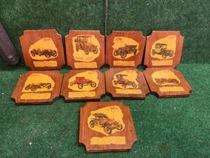 lot 195 image: Selection of car themed wall art or coasters