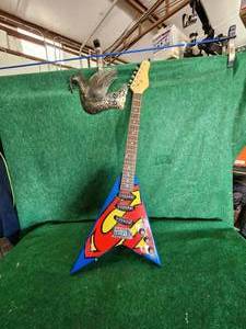 lot 299 image: Superman themed electric guitar
