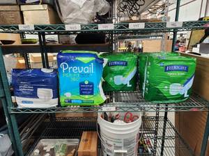 lot 447 image: Shelf lot of adult diapers