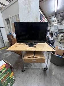 lot 495 image: Vizio TV with remote