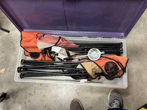 lot 513 image: 2 bins of camping fold up chairs