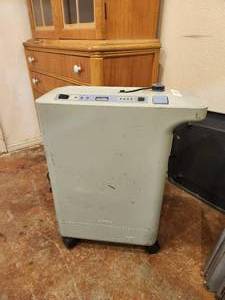 lot 568 image: Respironics Oxygen machine