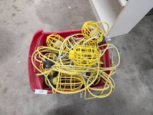 lot 124 image: Bin of tools and string of outdoor lights