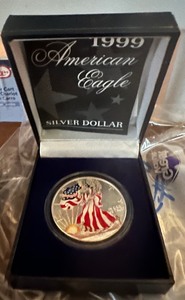 lot 5 image: 1999 AMERICAN EAGLE  SILVER DOLLAR  1 OZ FINE SILVER  COLORIZED