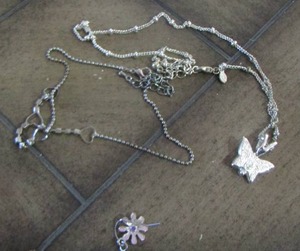 lot 302 image: butterfly necklace and flower necklace