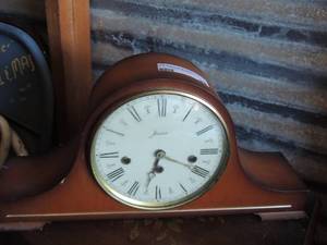 lot 98 image: Jlaid mantel clock with open door on the back