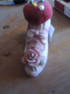 lot 186 image: Hand painted pink shoe pin cushion by Dezine