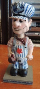 lot 170 image: train conductor figurine