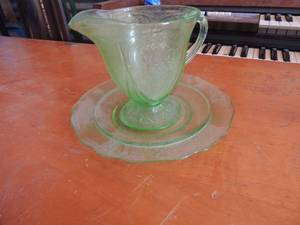 lot 176 image: Green glass cup and saucer