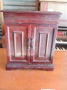 lot 148 image: Brown jewelry box with two side doors top opens for ring storage , 4 hidden drawers inside
