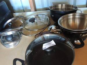 lot 42 image: 8 assorted pan lids, black and grey food strainer, black pot with lid and more